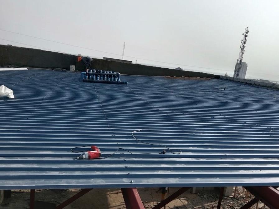 High-angle view of a modern industrial roof with corrugated steel